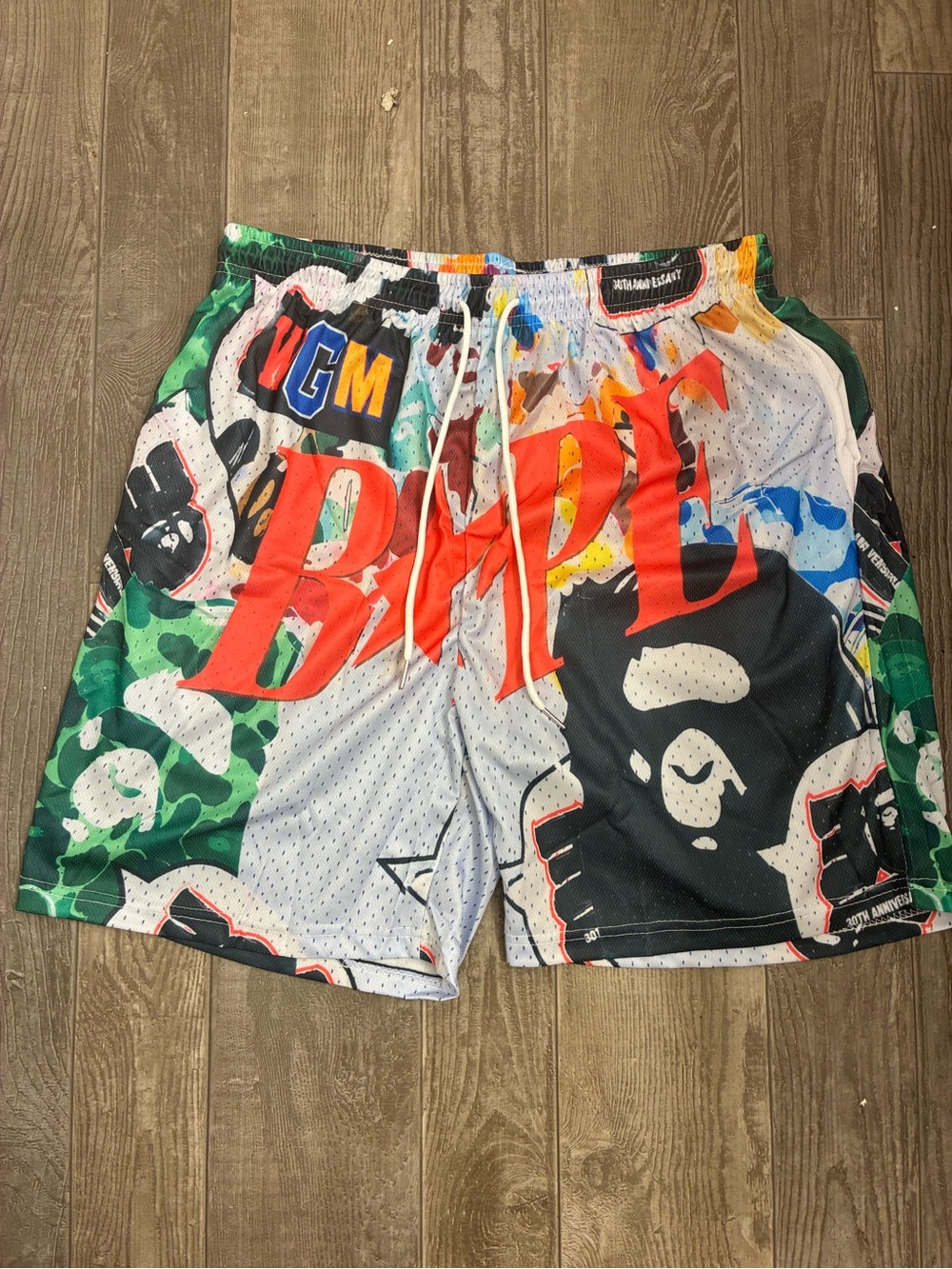 BAPE Multi-Color Graphic Mesh Shorts with Bold Logo Size Medium